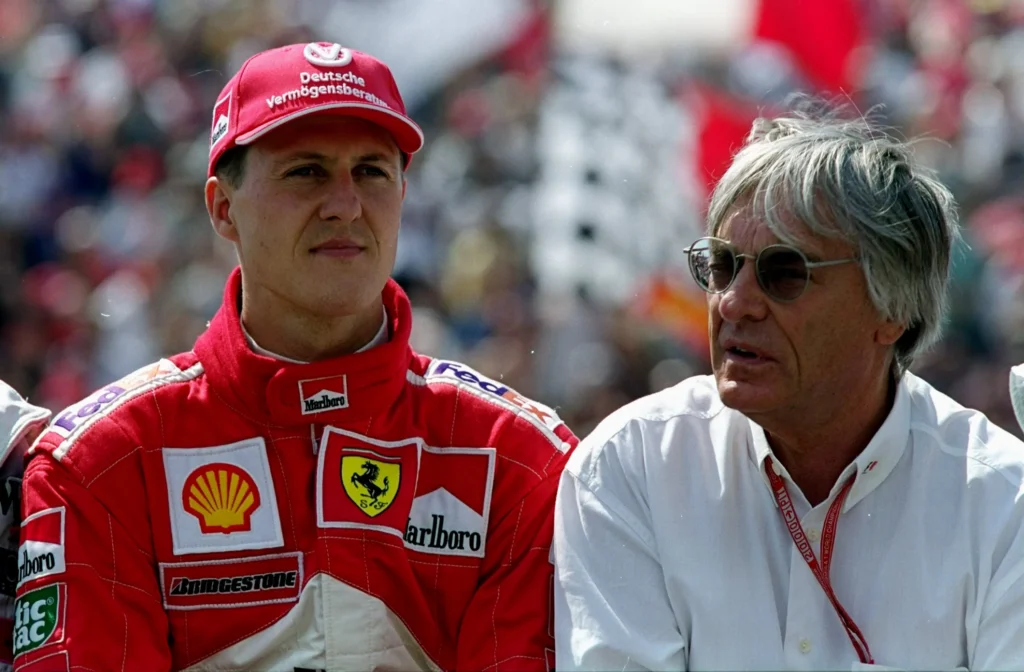 Bernie Ecclestone, pictured to the right